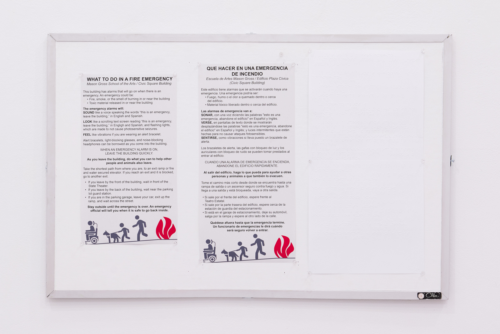 Printed and embossed text in English, English Braille, and Spanish
        on vin-tak bulletin board used by Rutgers University.
        Text is proposed instructions for evacuting the building, and an
        illustration in the style of ISO-graphics of a person using a powerchair,
        a person of short stature holding a
        dog wearing a harness, and a taller upright person, fleeing down a
        ramp away from flames. There is a sticker on the lower right corner of aluminum frame of the bulletin board.